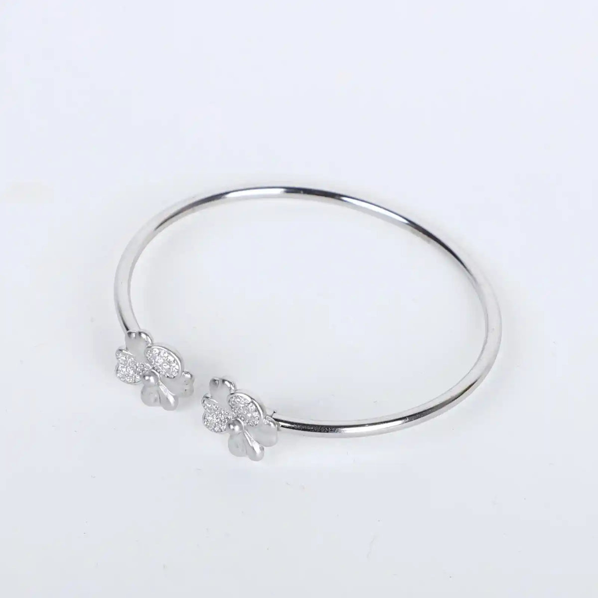 Elegant silver kadha bracelet with intricate flower design