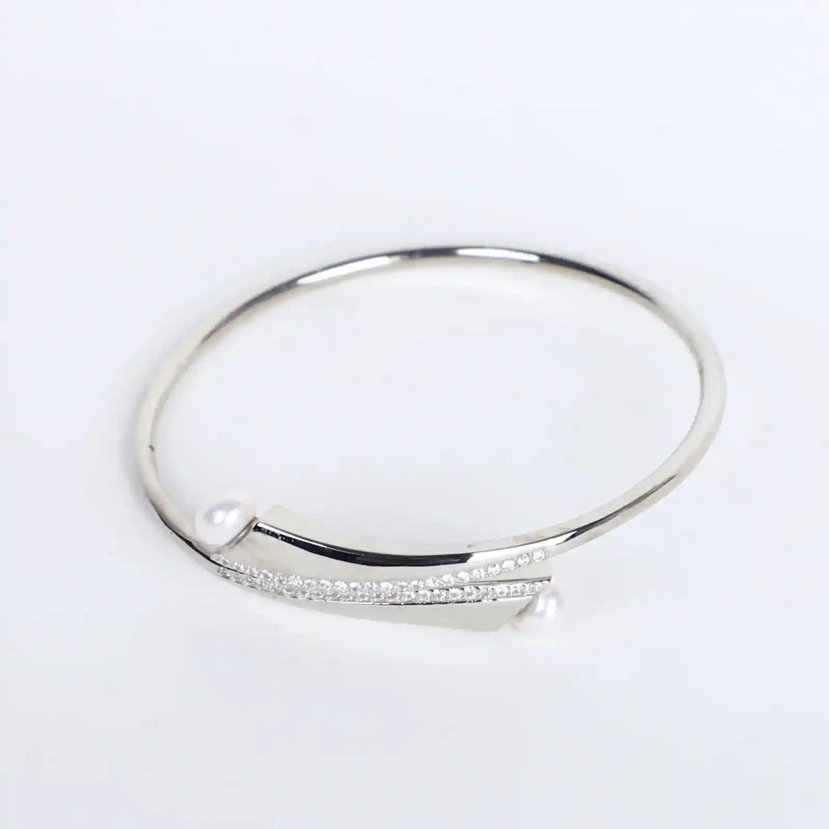 Silver kadha bracelet with elegant pearl stud accents