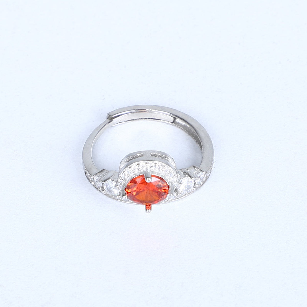Women's fiery orange gemstone ring – halo design with sparkling accents