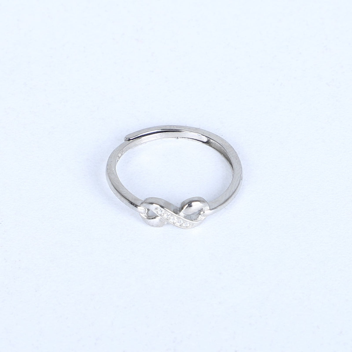 Women's infinity knot ring – dainty silver band with cubic zirconia accents