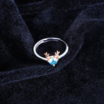 Load image into Gallery viewer, Women's Whimsical Blue Gemstone Ring with Rose Gold Antler Accents
