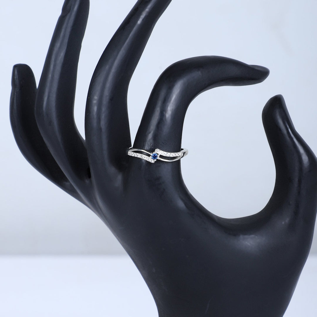 Women's Silver Wave Ring with Blue Sapphire Accent – Elegant & Minimalist Design
