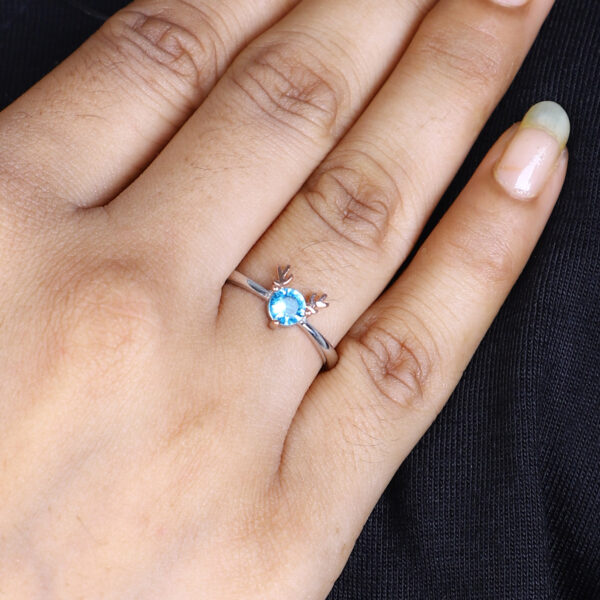 Women's Whimsical Blue Gemstone Ring with Rose Gold Antler Accents - Image 4