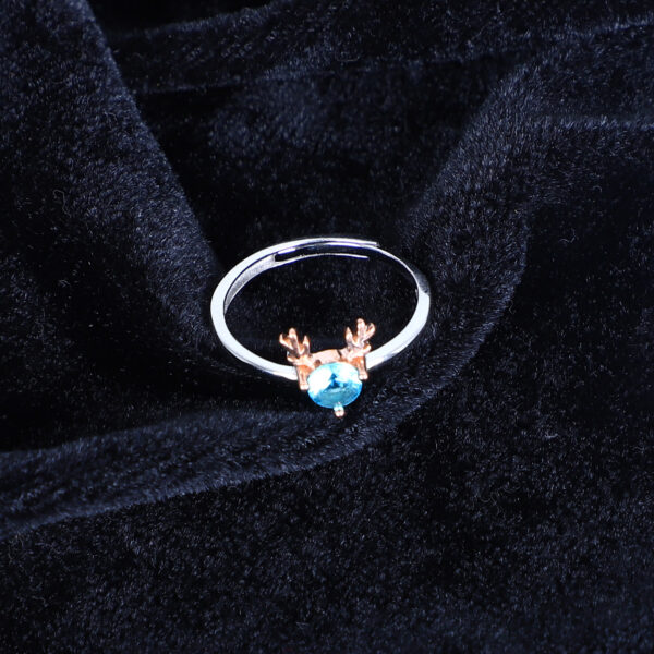 Women's Whimsical Blue Gemstone Ring with Rose Gold Antler Accents - Image 2