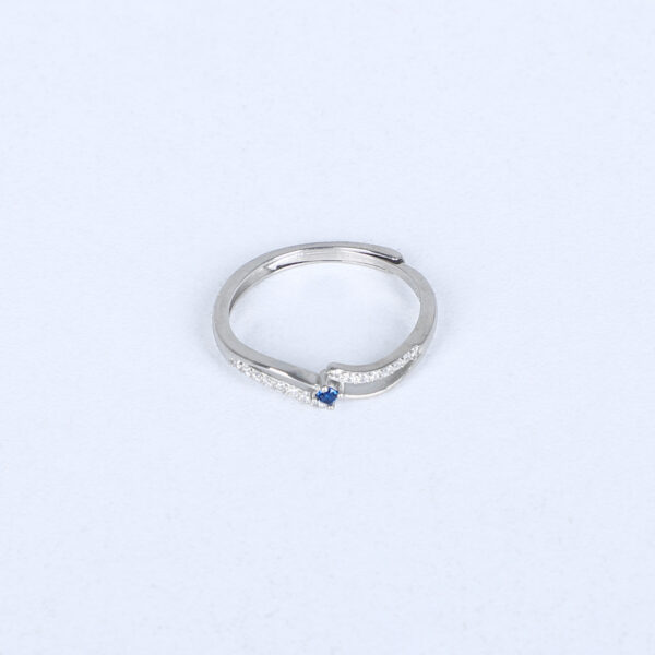 Women's Silver Wave Ring with Blue Sapphire Accent – Elegant & Minimalist Design